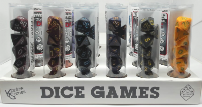 Display of 24 tubes of speckled polyhedral dice kits