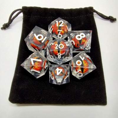 Liquid Core Dragon Eye dice kit - translucent with red dragon eye in a bottle with screw-cap