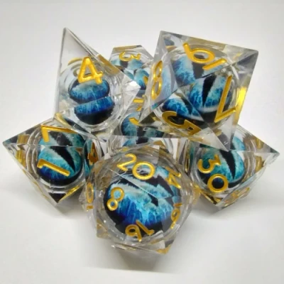 Liquid Core Dragon Eye dice kit - translucent with blue dragon eye in a bottle with screw-cap