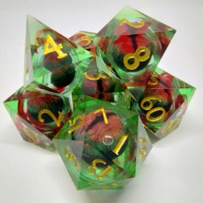 Liquid Core Dragon Eye Bloodlines dice kit - green and red in a bottle with screw-cap