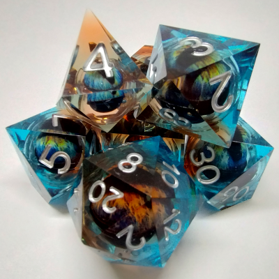 Liquid Core Dragon Eye dice kit - blue / orange in a bottle with screw-cap