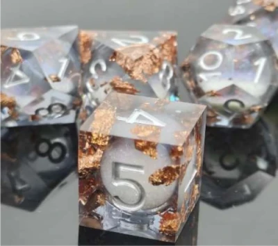 Liquid Core Maelstrom of Dreams dice kit - silver grey with gold foil in a bottle with screw-cap