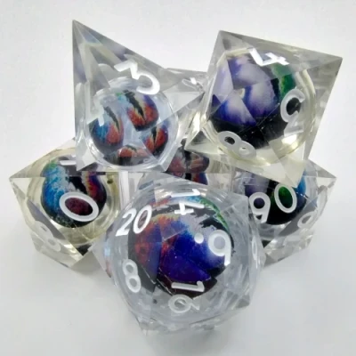 Liquid Core Dragon Eye dice kit - transparent with multicoloured eye in a bottle with screw-cap